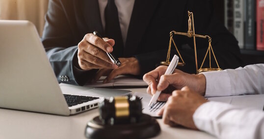 business people and lawyers discussing contract papers sitting at the table. Concepts of law, advice, legal services. in morning light