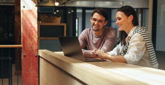 Business professionals joining an online conference in a coworking office