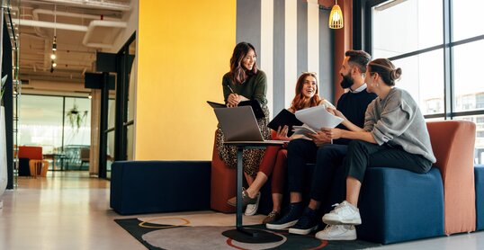 Multicultural businesspeople working in an office lobby